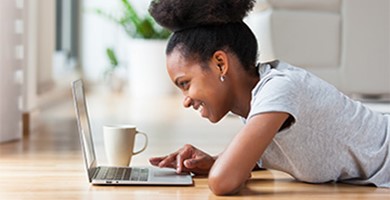 Online Security image showing young woman banking online